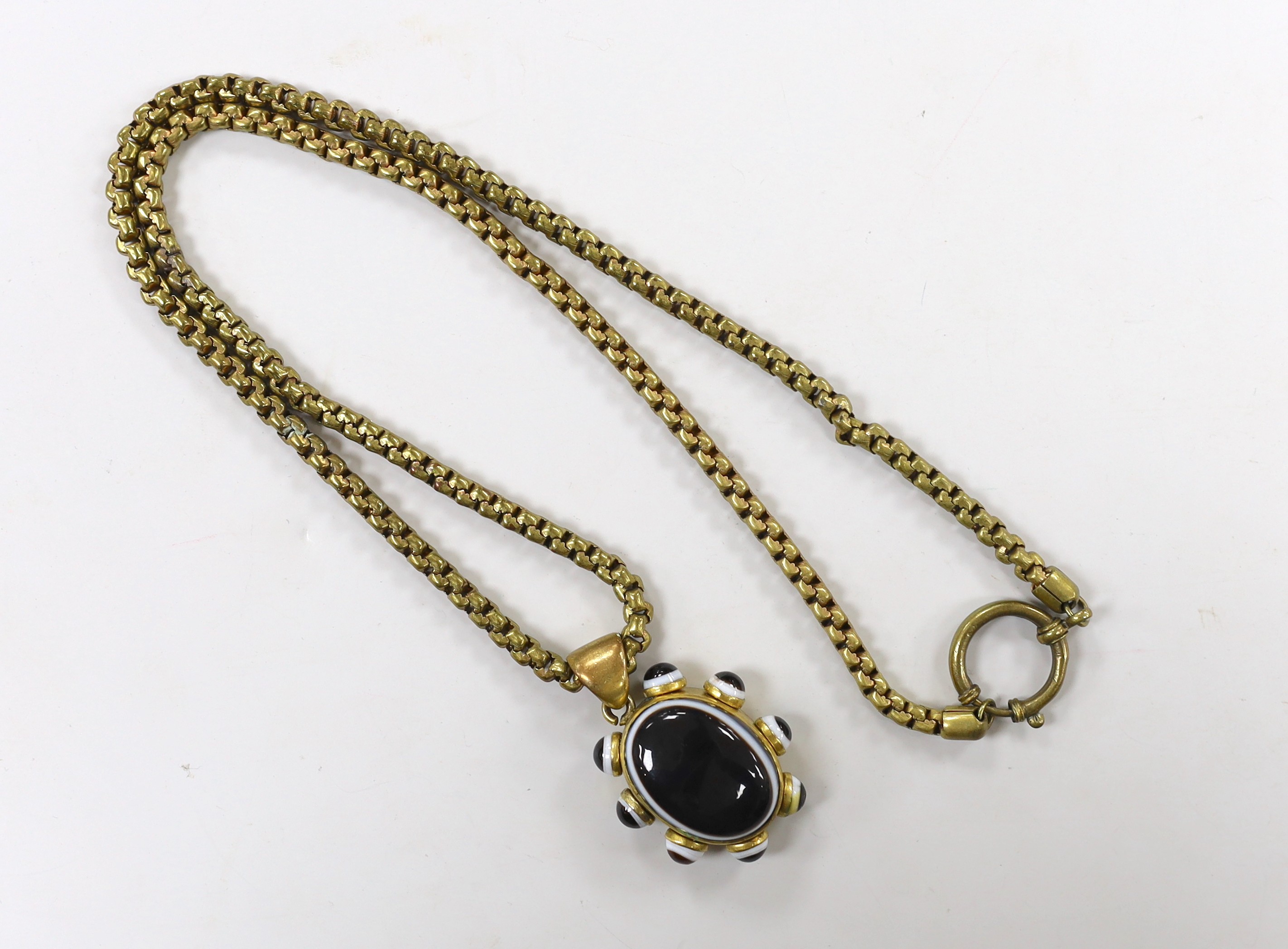 A Victorian pinchbeck and banded agate set pendant, 39mm, on a gilt metal chain.